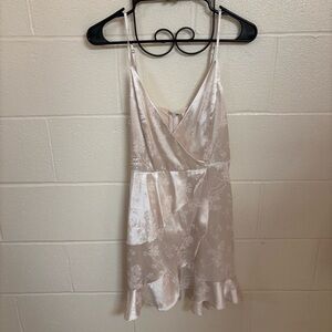 Silver floral Altar’d State minidress with crossover V-neckline and ruffles